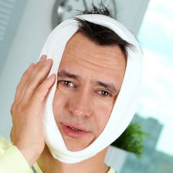 man with tooth pain from swelling